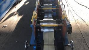 Embossing rolling shutter door forming machine