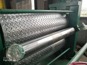 Metal sheet embossing machine